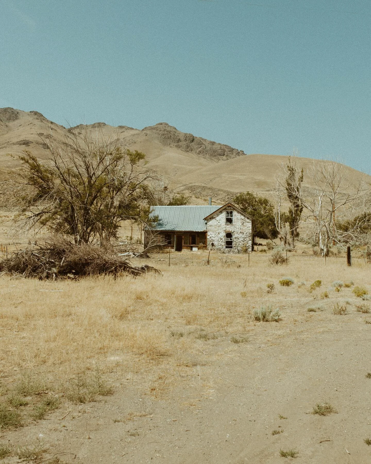 An old empty house somewhere out near the Oregon/Nevada border. Must have been pretty interesting living out there back when it was new.  Not much water around that I know of!