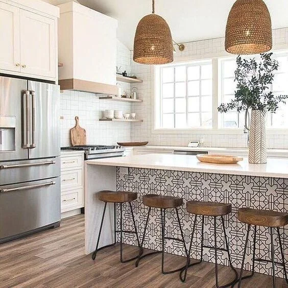 Bright All White Kitchen with Wooden Carved Kitchen stools for a white counter, and rattan lights.jpeg