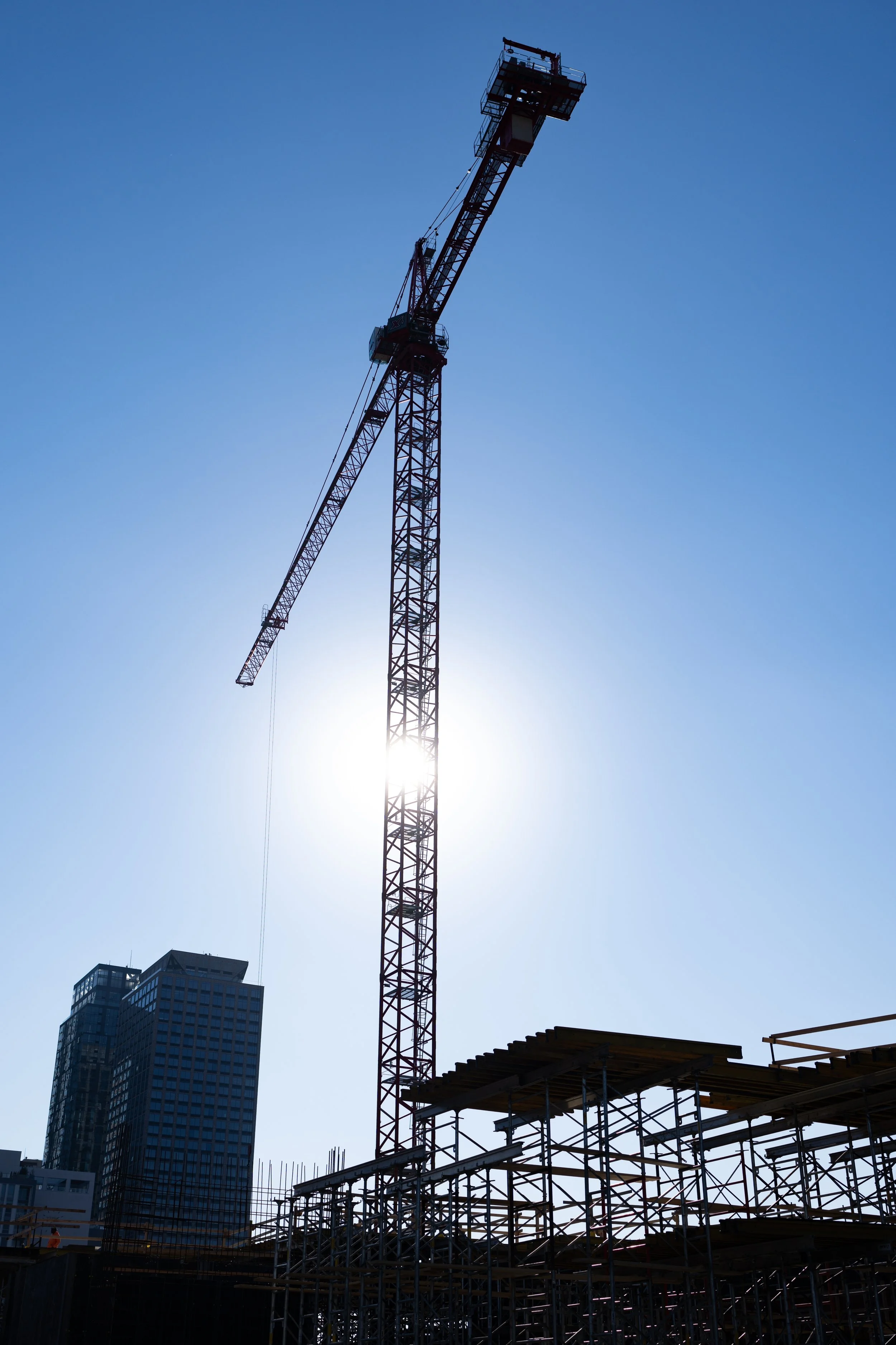 view of giant crane from the ground looking skyward