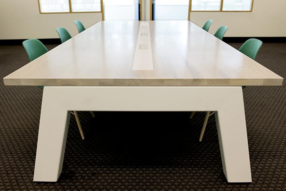  Custom White Ash, white washed top with custom steel powder coated base. Power and data integration in work tables with discreet cable management. 