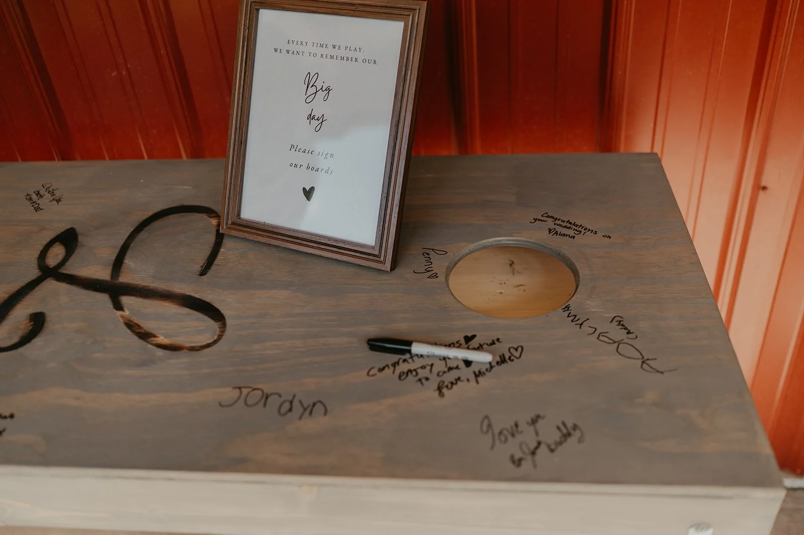 Cornhole boards used as alternative wedding guestbook at Adler Ranch Wedding Venue  near Alexandria MN