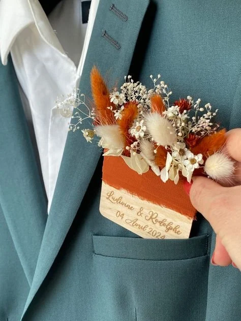 Photo of Pocket boutonniere on mens blue wedding suit at MN Wedding Venue, Adler Ranch Wedding Venue, what to do with wedding dress extra fabric