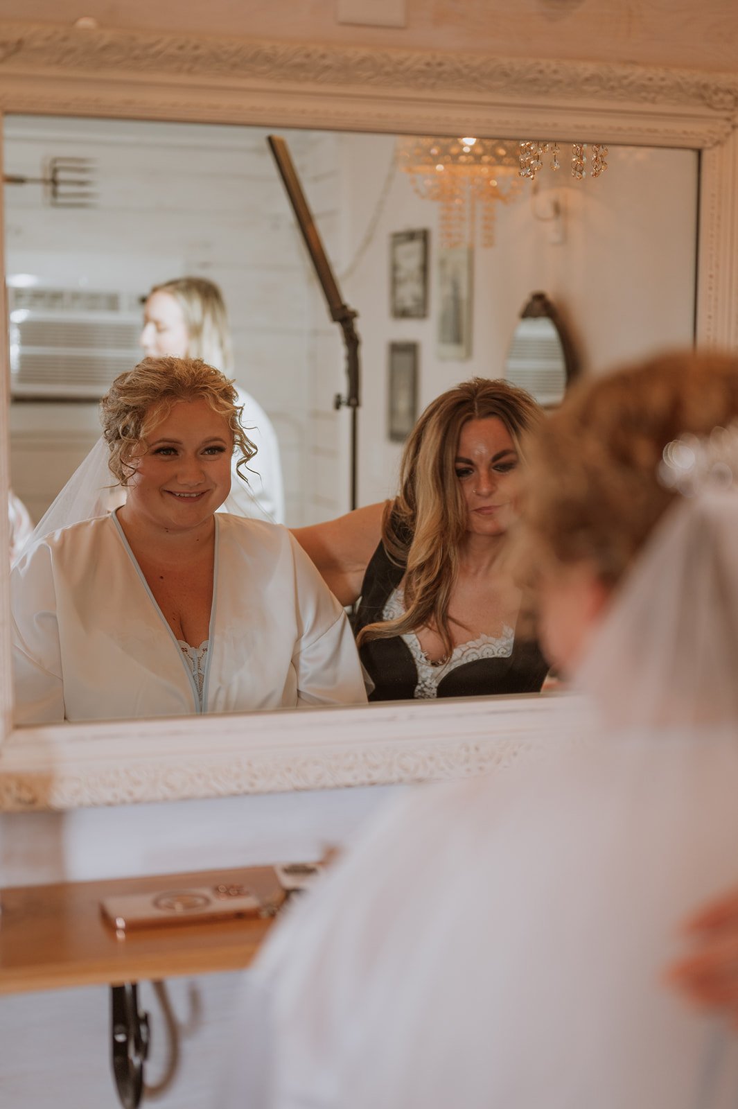 Bride at the Adler Ranch Cabin wearing a beautiful dressing gown, showing options that can be made from mom's reused wedding dress fabric