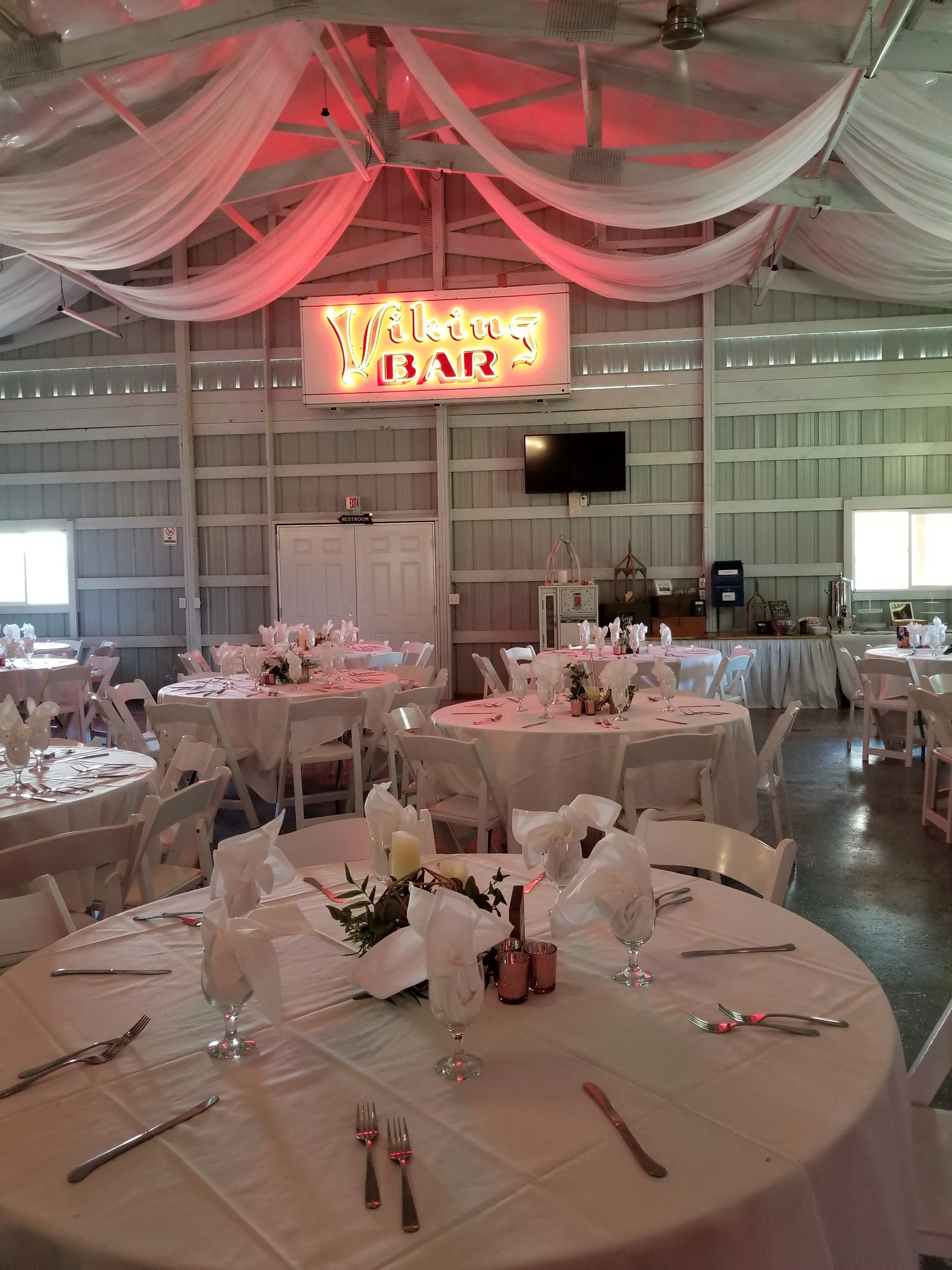 Photo of the Banquet Barn at Adler with decorated table settings ready for a wedding meal