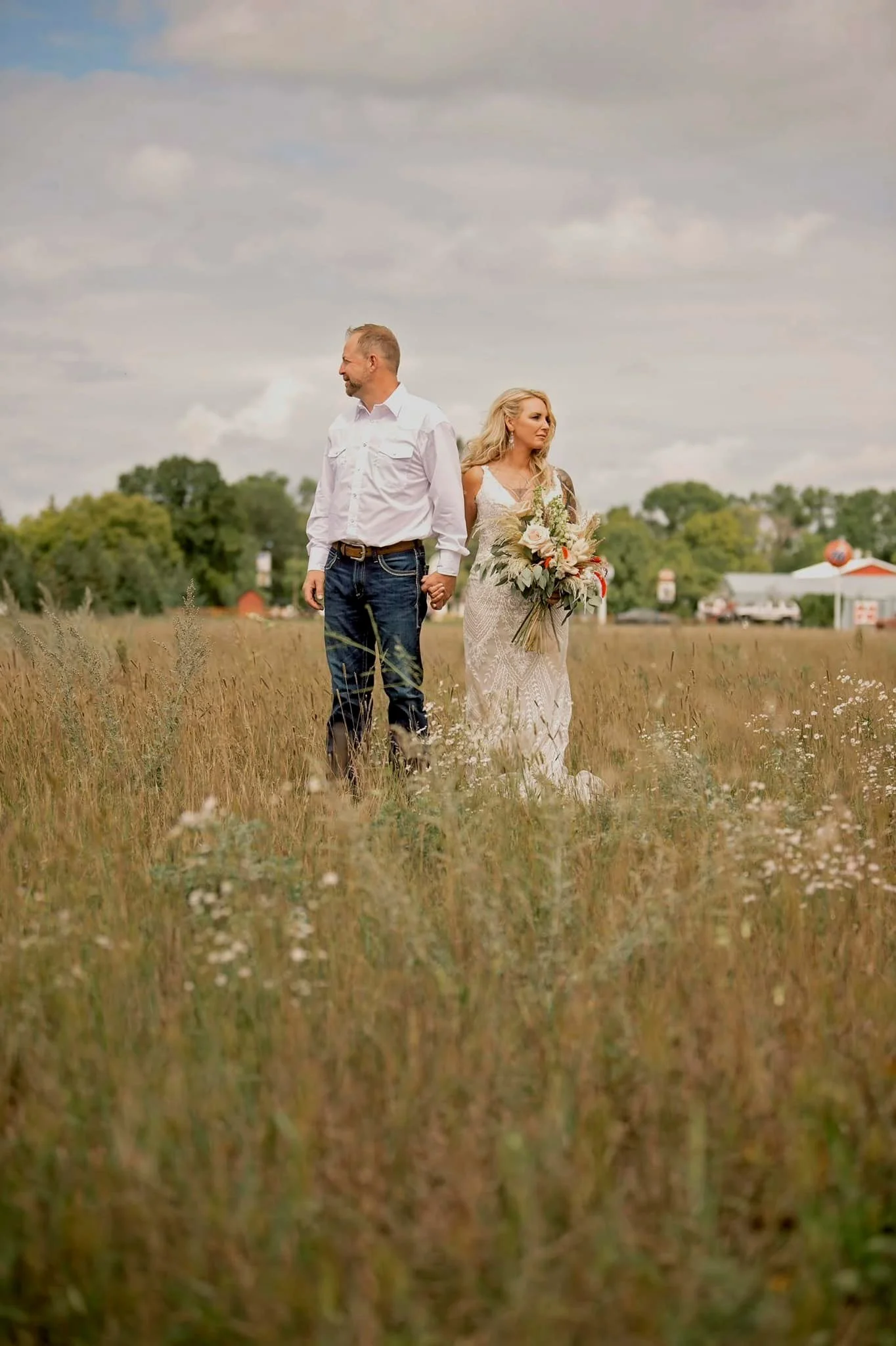 Bride & Groom at the Adler Ranch Wedding Venue located two hours from Minneapolis and two hours from Fargo ND near Alexandria MN.  Beautiful Outdoor Wedding Ceremony location, wildflower field . Wedding Venues Alexandria MN, outdoor reception venues