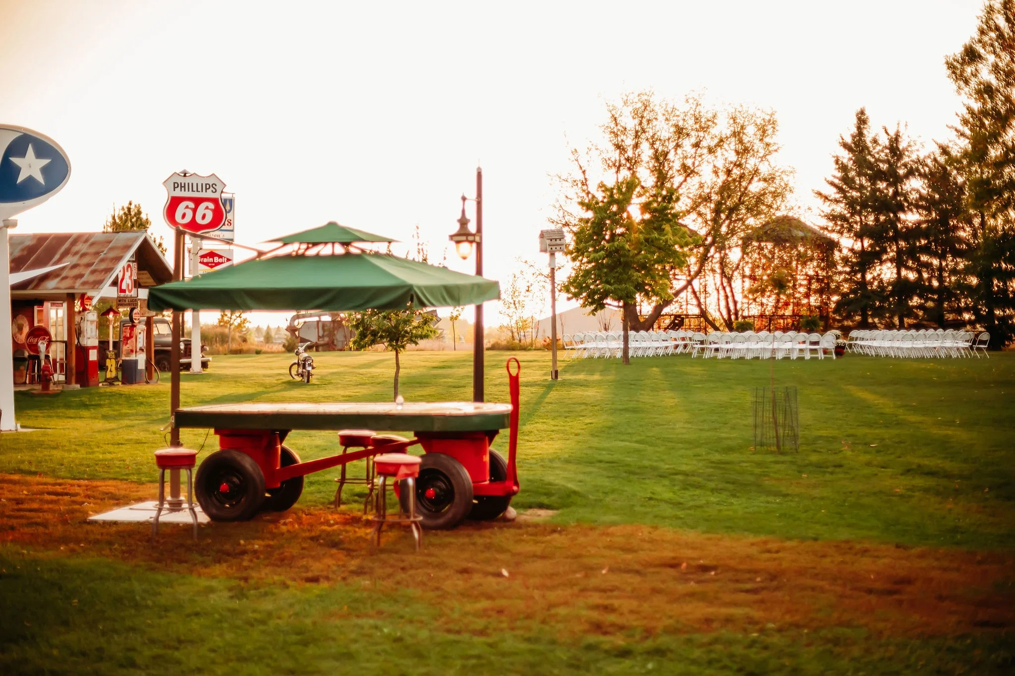 Vintage luggage cart bar with overhead canopy at Adler Ranch wedding venue