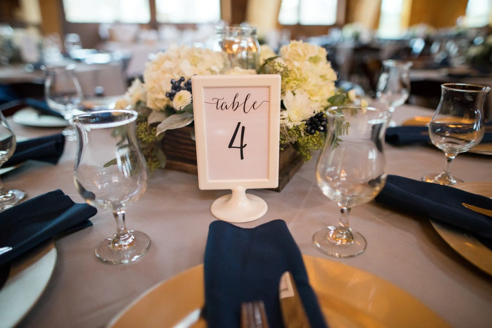 Indoor wedding venue space prepared for reception with no clutter or unfinished setup