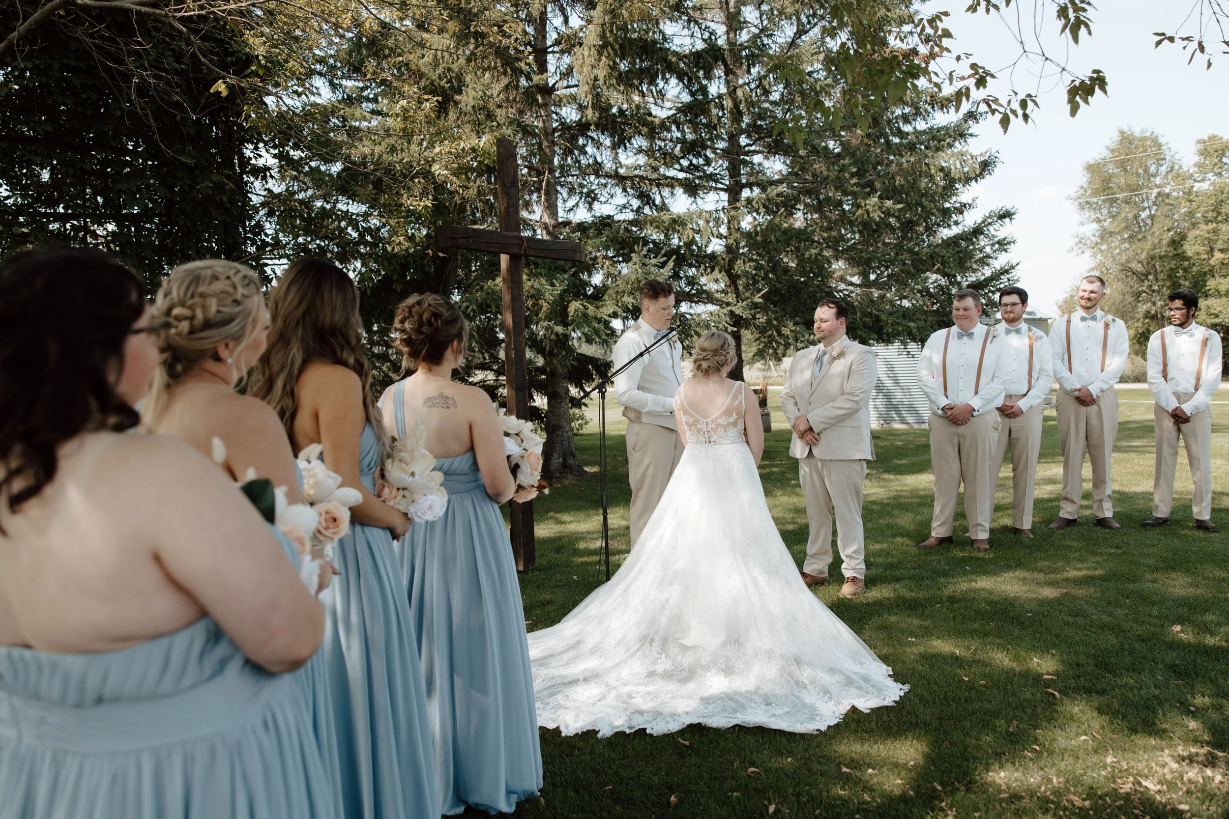 Bride, Groom and wedding party during wedding ceremony at MN Wedding Venue Adler Ranch