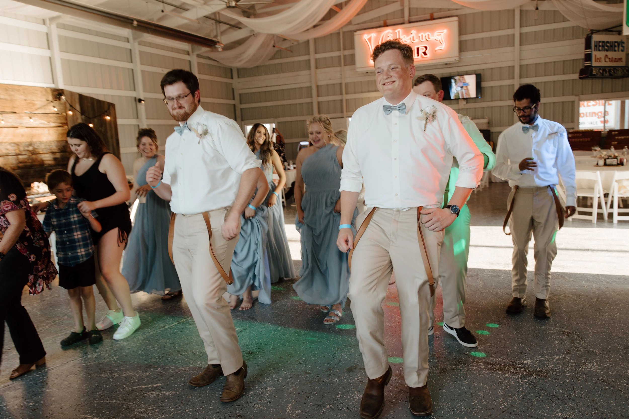 Groomsmen dancing at Adler Ranch Wedding Venue near Alexandria MN