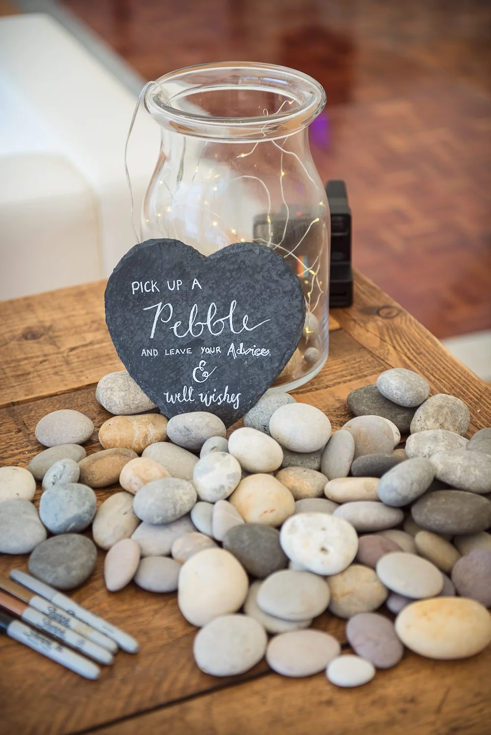 Jar with pebbles that can be written on for alternative guestbook option