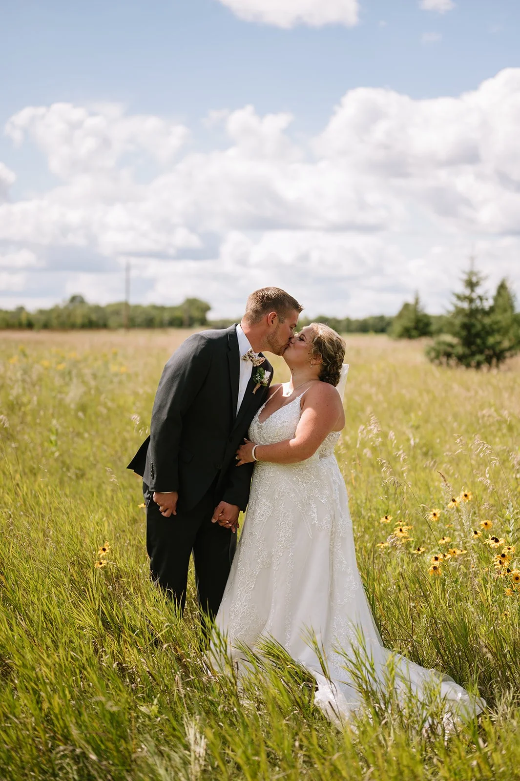 Just married coupe at the wildflower field at Adler Ranch wedding venue