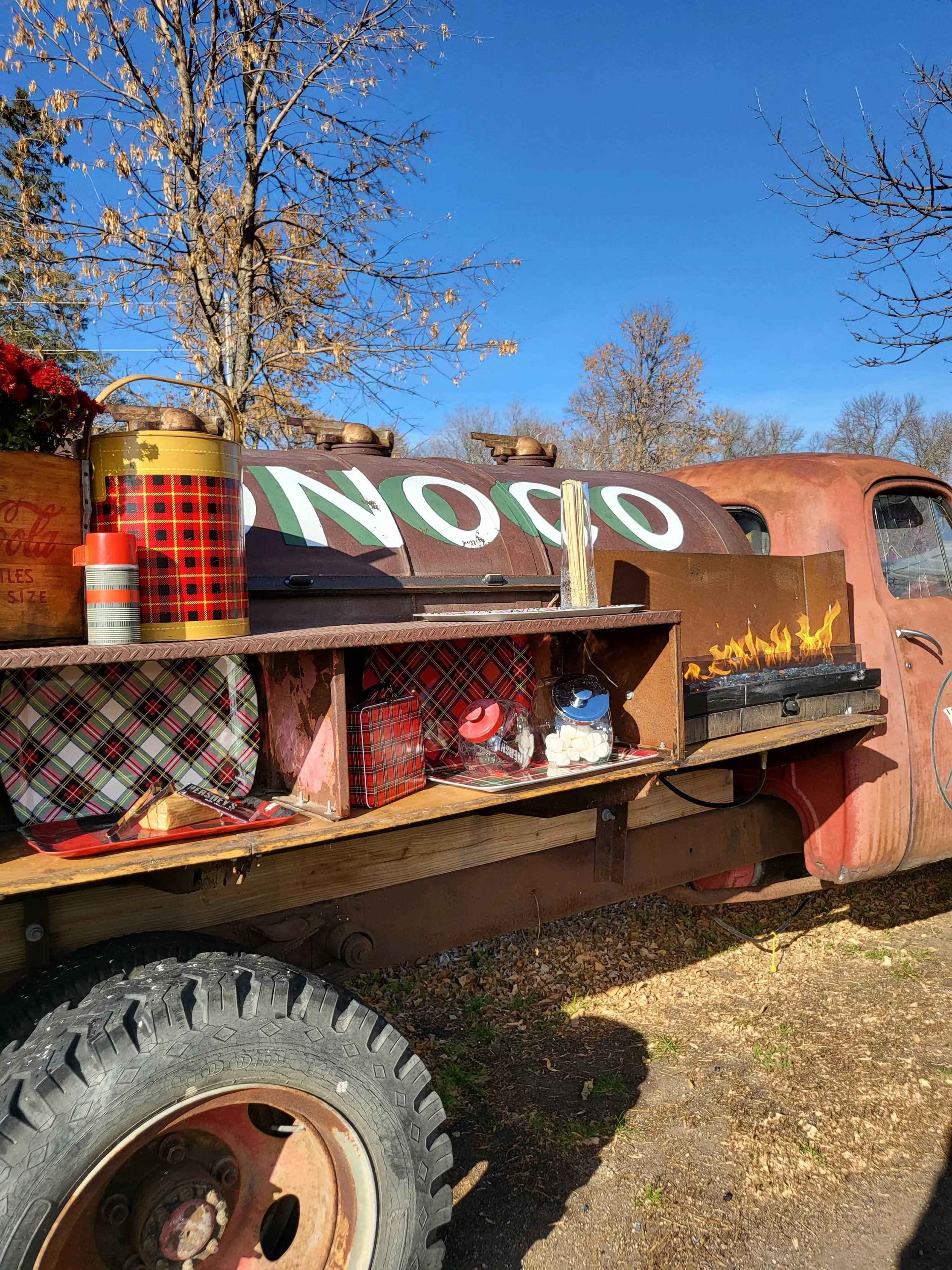 The Smore bar at Adler Ranch, a decorated smore bar, mounted on the side of a Studebaker gas truck