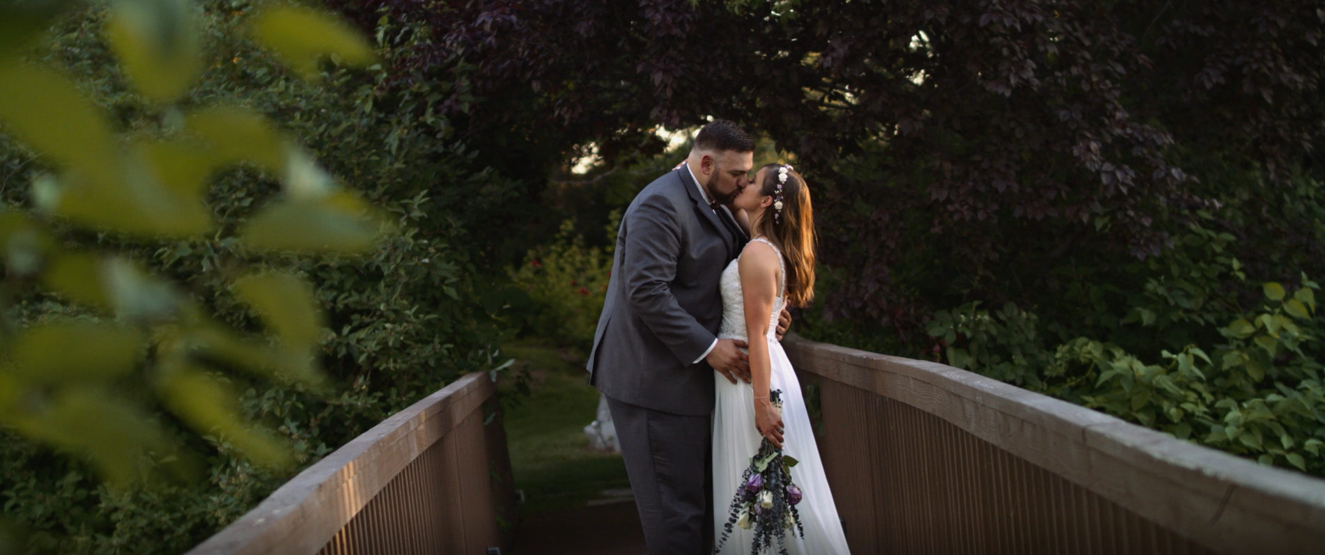 Stolen moments of the bride and groom in the secret garden!