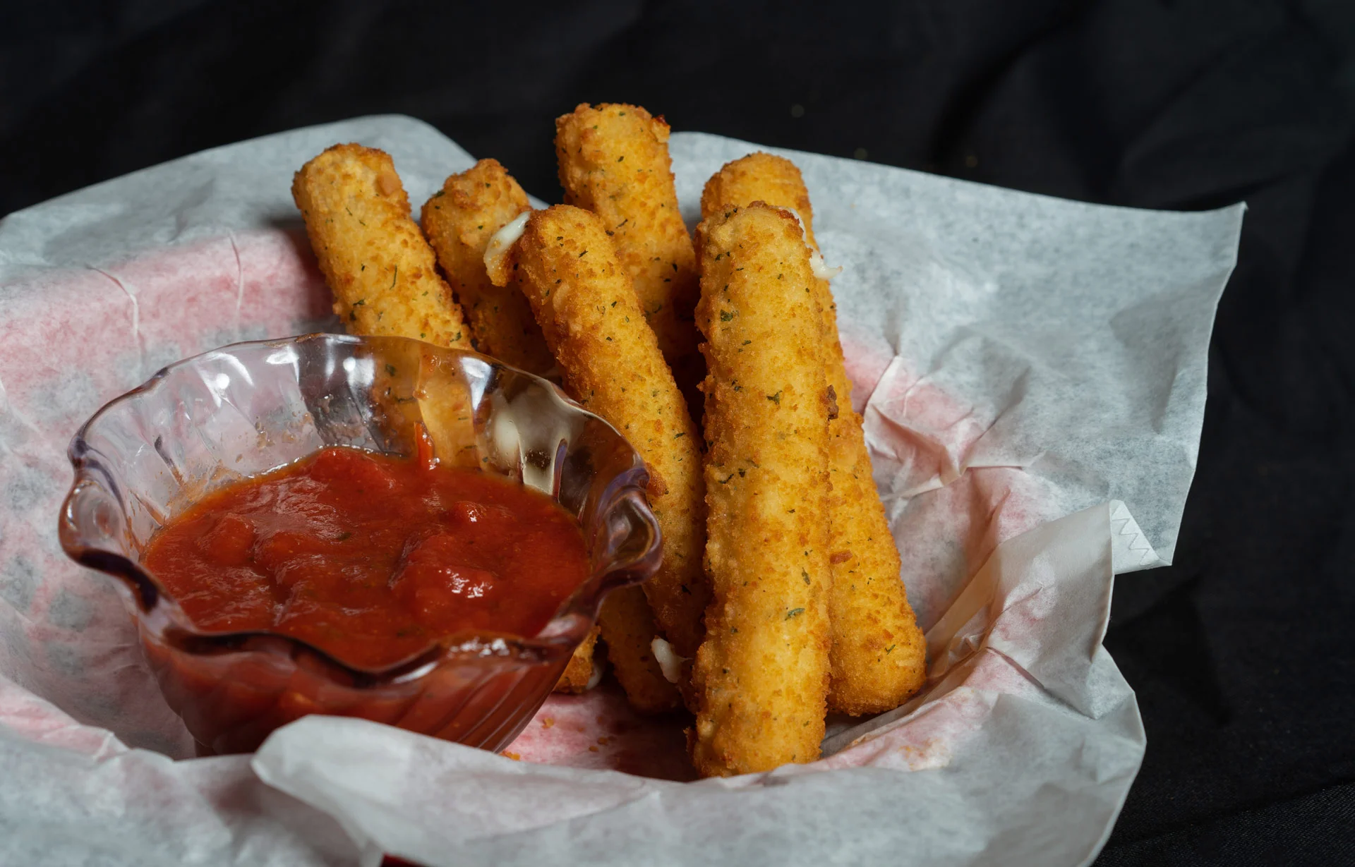 Mozzarella Cheese Sticks Stringy mozzarella cheese lightly breaded and fried to a golden brown. Served with marinara sauce 6.00