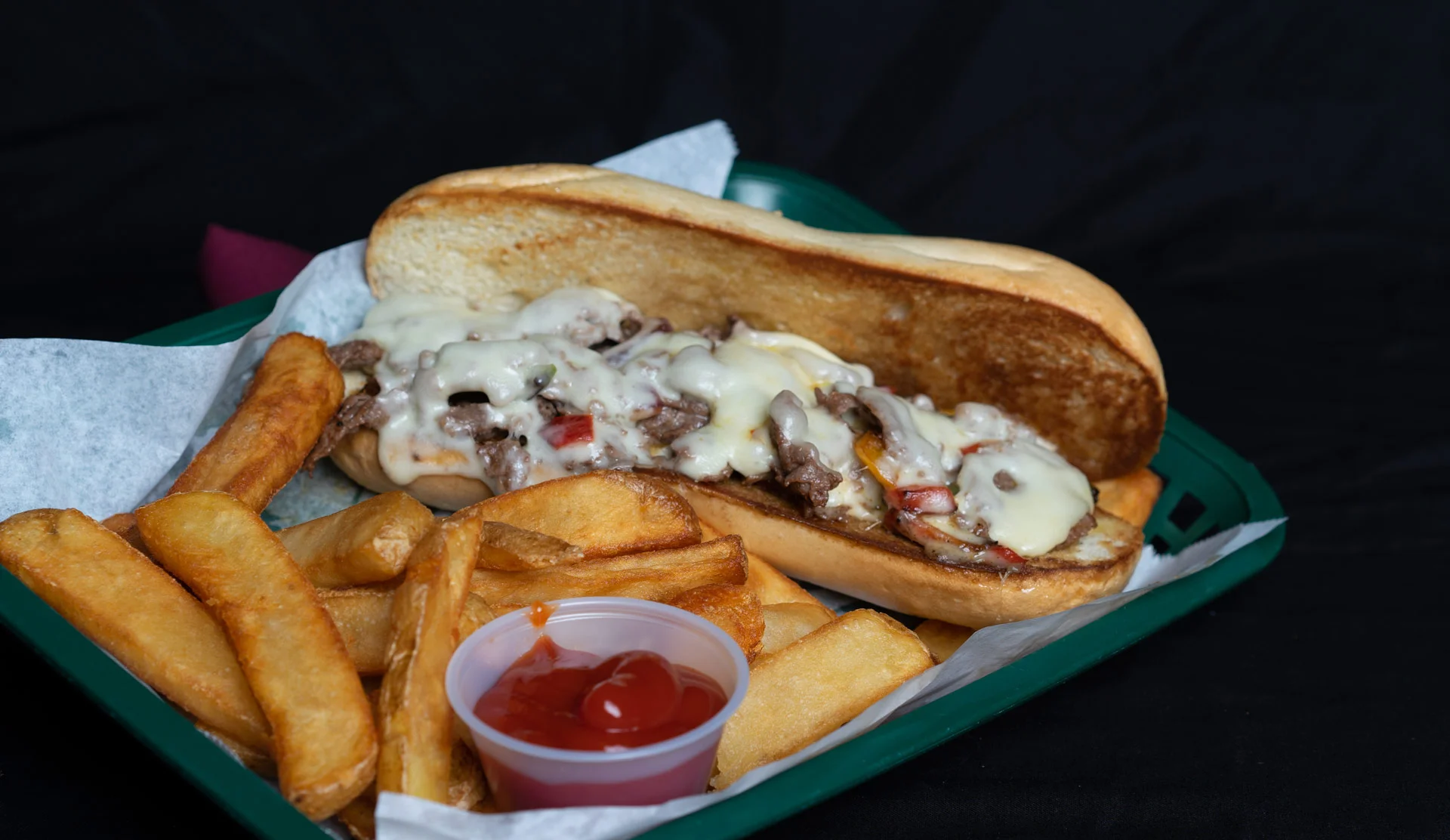 The Philly Cheese Steak Premium grilled sirloin or chicken, topped with grilled onions, assorted bell peppers and covered with melted Swiss cheese on a toasted hoagie bun. Served with your choice of steak fries, french fries, onion rings, chips, or Texas Toothpicks. 8.00