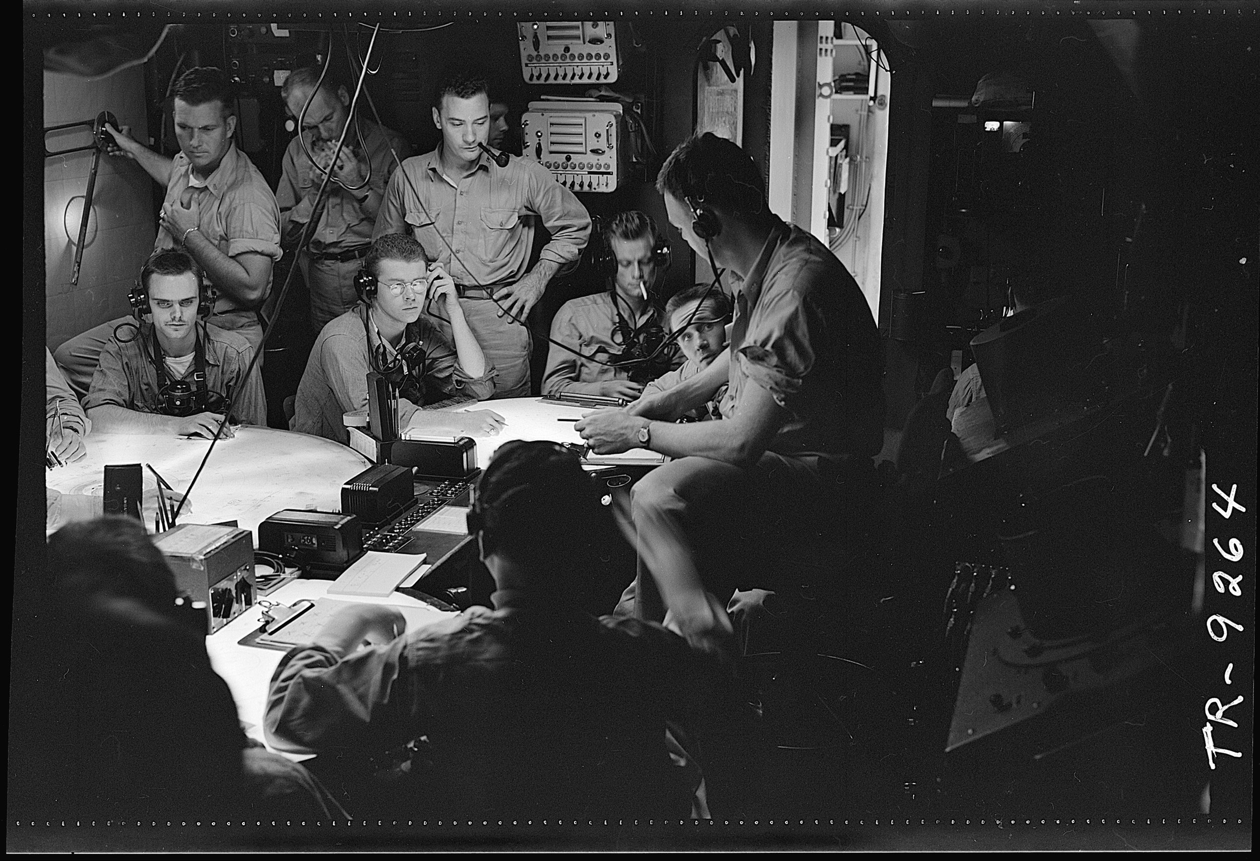 Lt._Cdr._A.F._Fleming,_fighter_director,_in_plot_room_of_USS_Lexington_(CV-16)_during_a_strike_in_the_Gilbert_&_Marshall_Islands_-_NARA_-_520799.jpeg