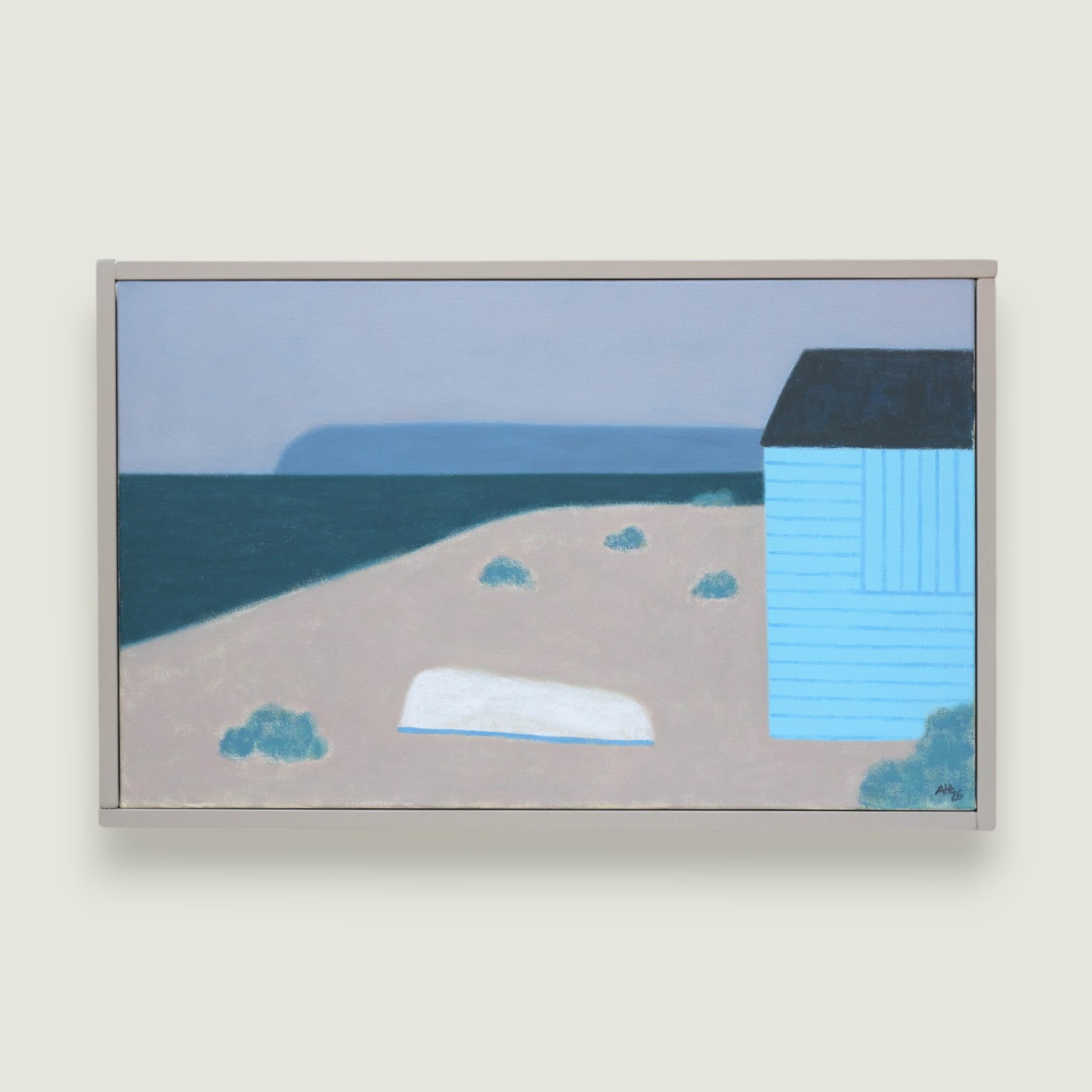 Blue beach hut and upturned boat