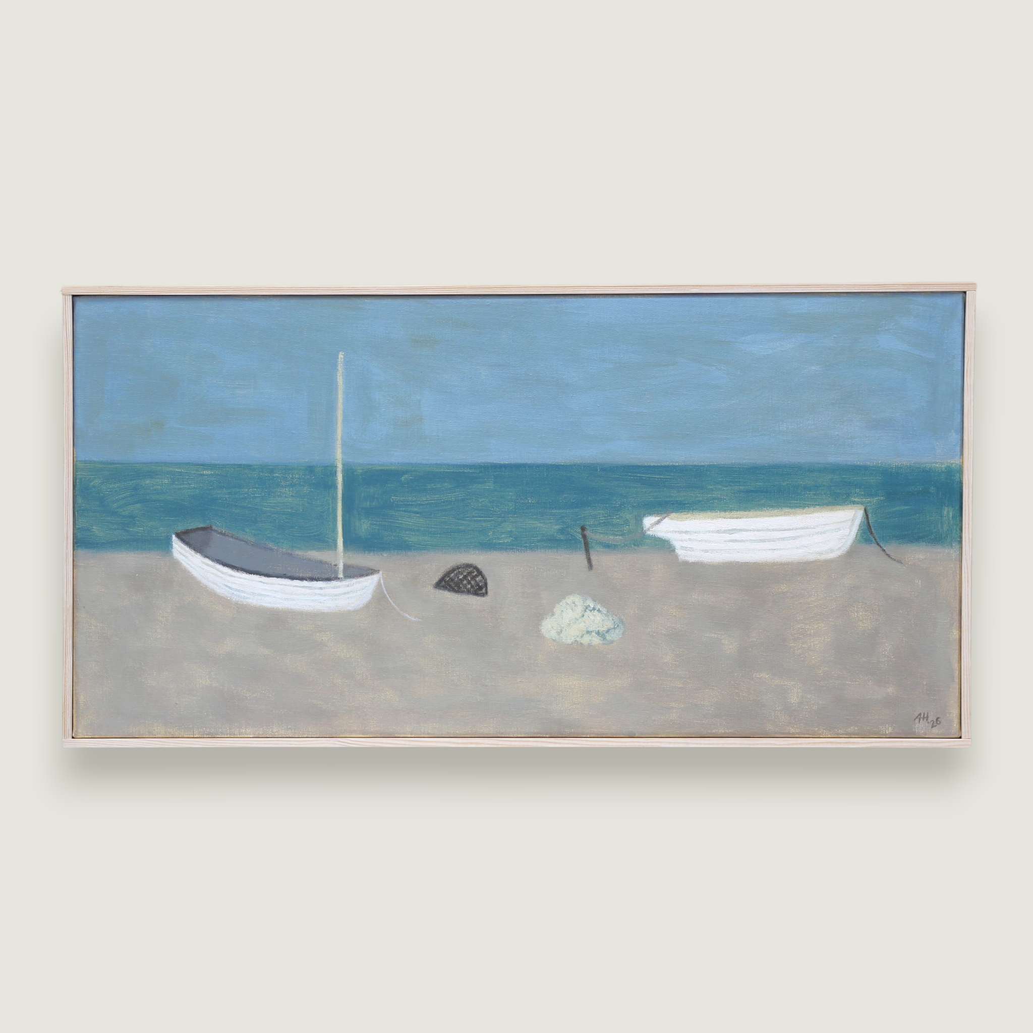 Lobster pot and sea kale between two boats