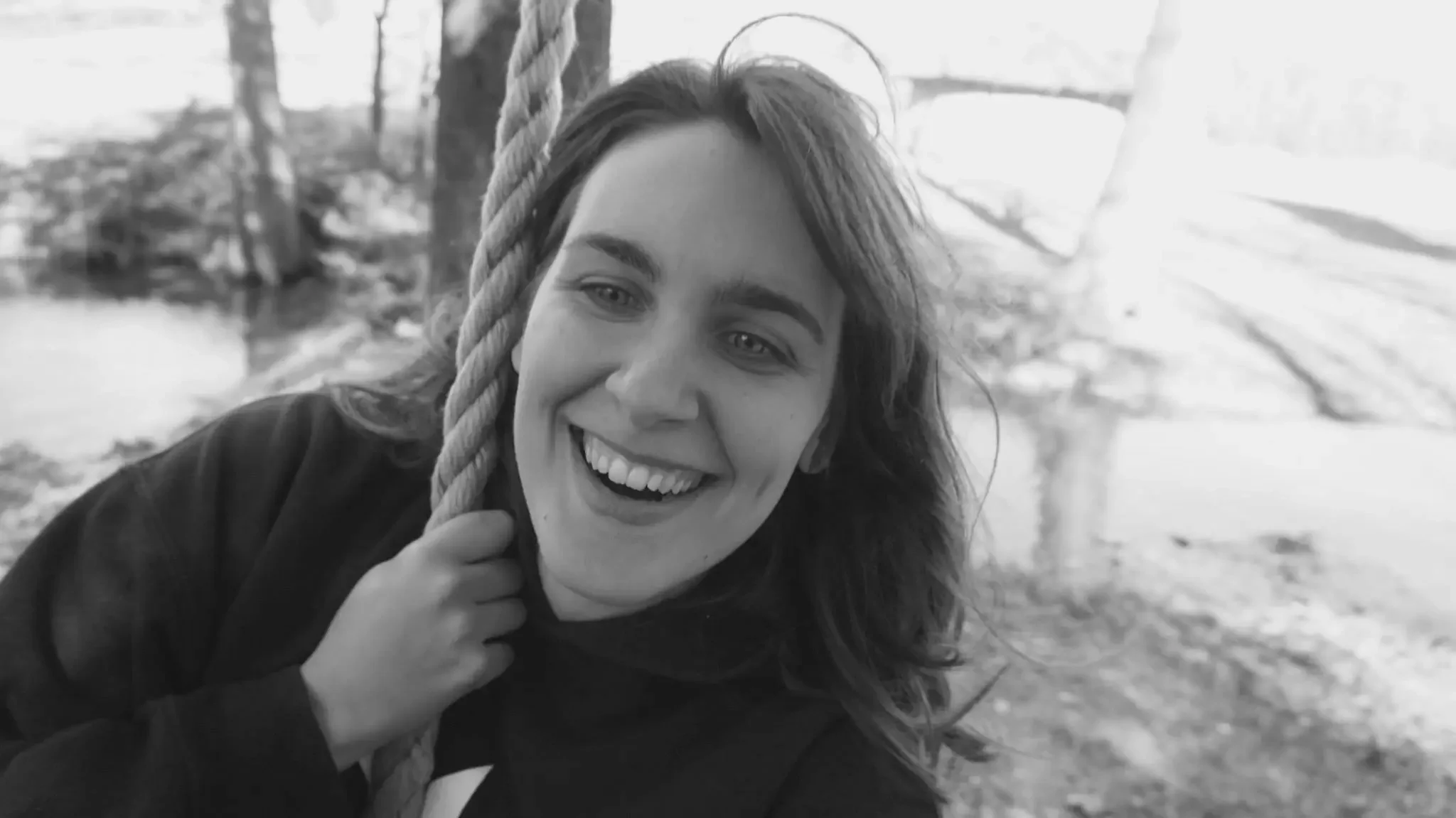 Hannah Williams, Phil Williams' late daughter, laughing on a rope swing