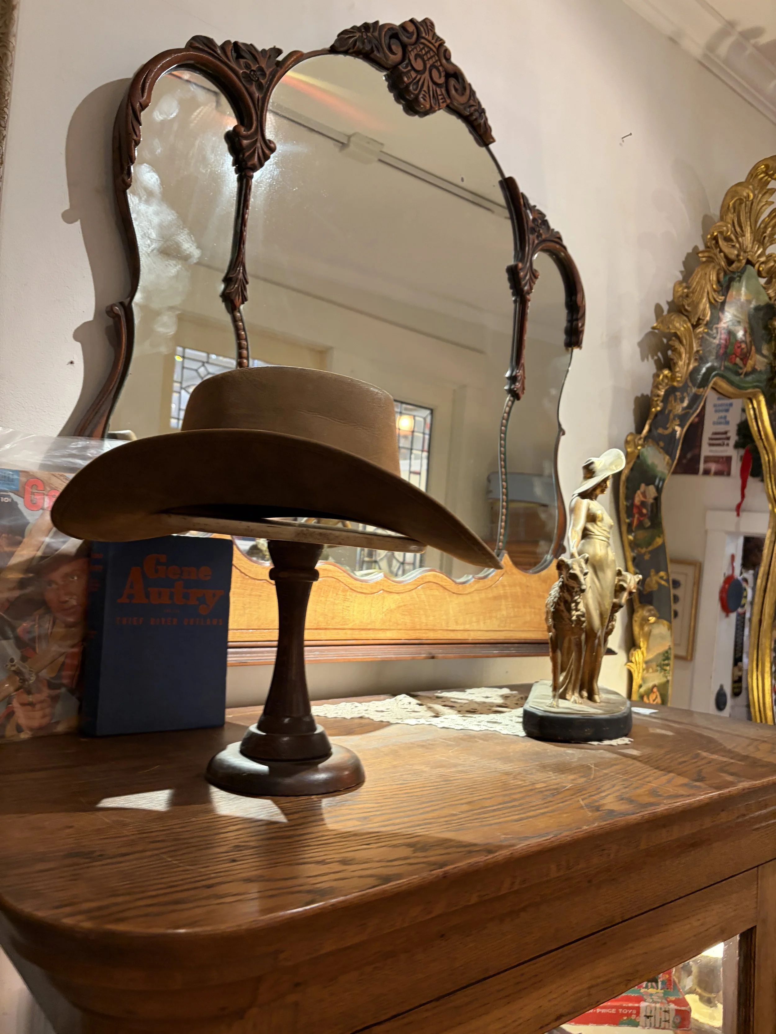 Vintage cowboy hat and eclectic antique display at Wexford General Store Antiques in Wexford, Pennsylvania