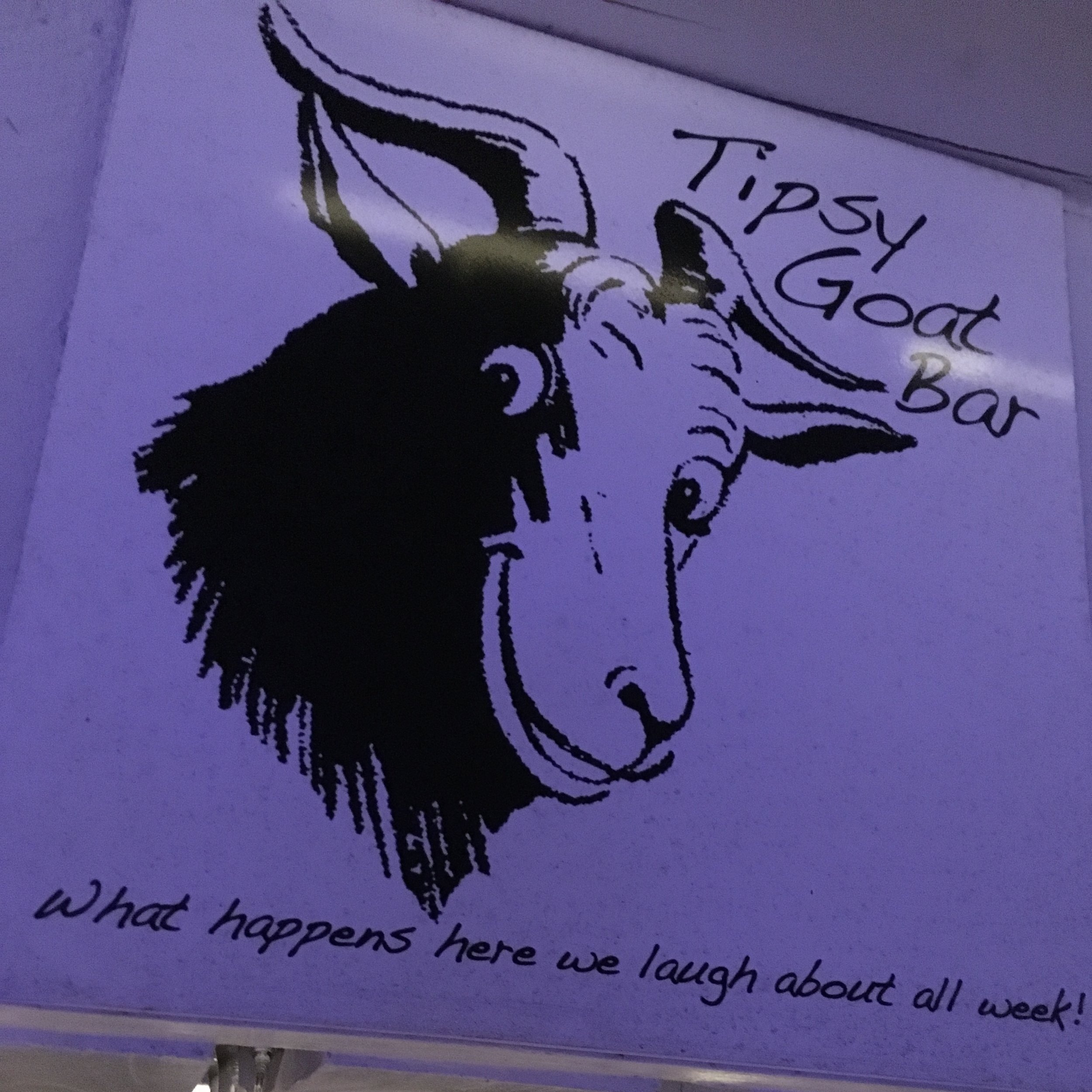 Tipsy Goat bar at Juliana's... this place is a hoot! The slogan is cut off: "What happens here, we laugh about all week."