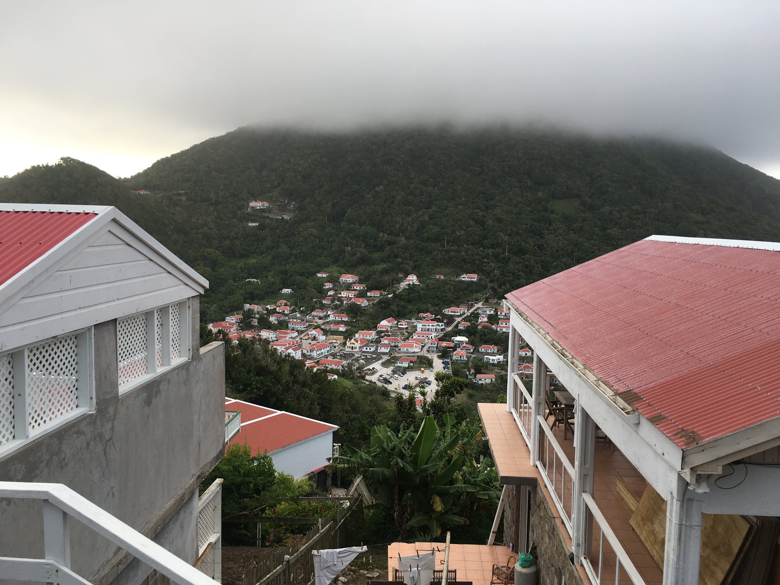 View of Windwardside from The Level, Mt. Scenery shrouded in clouds. This is the view Boone and Emily would have, coming down from El Momo.