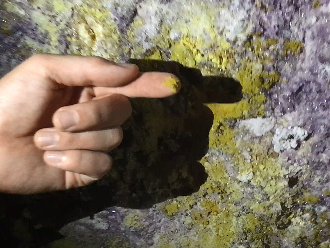 The yellow stuff is sulphur... the purple crystals are a form of gypsum.