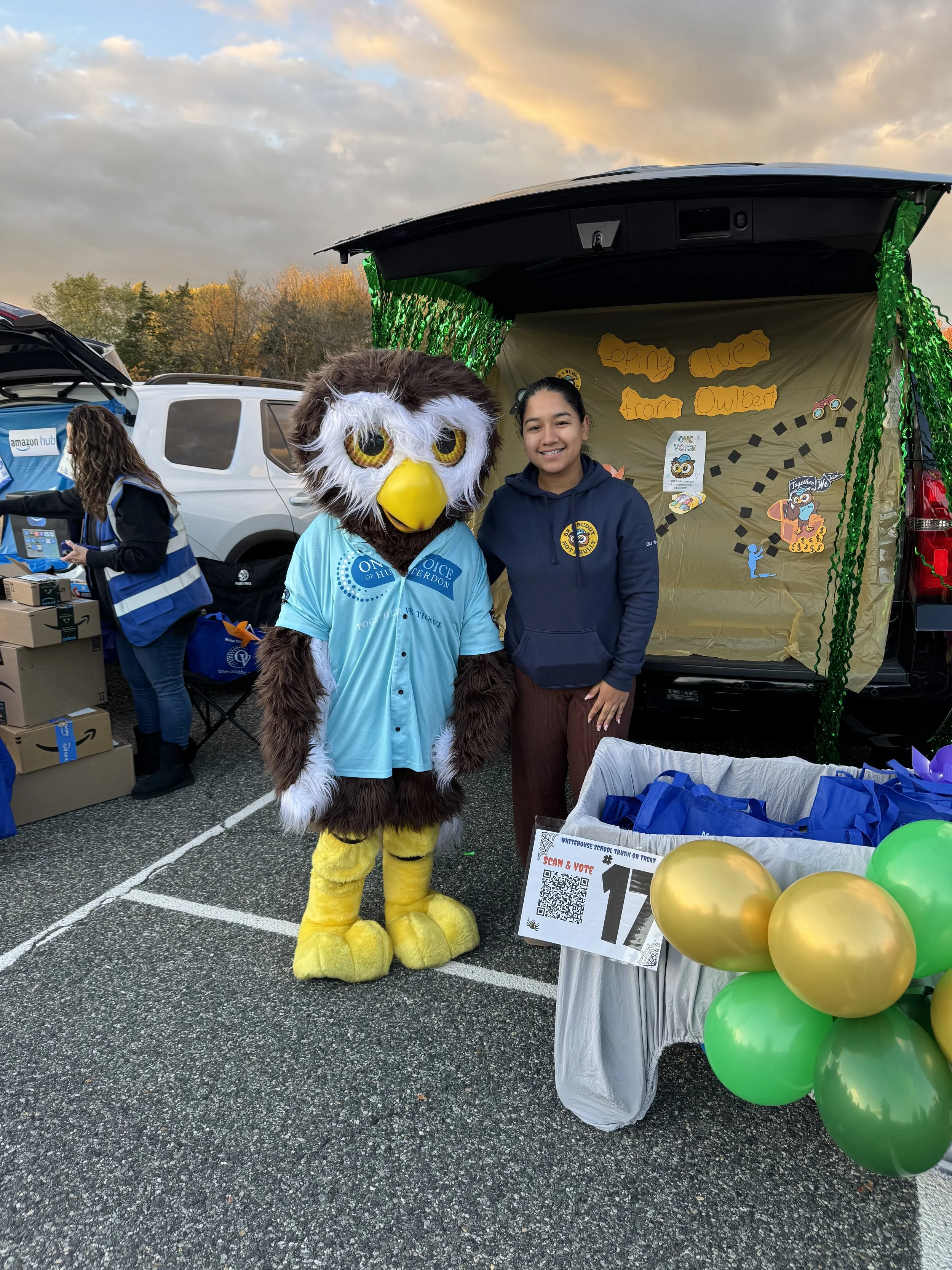 Amy and Owlbert infron of trunk.jpeg