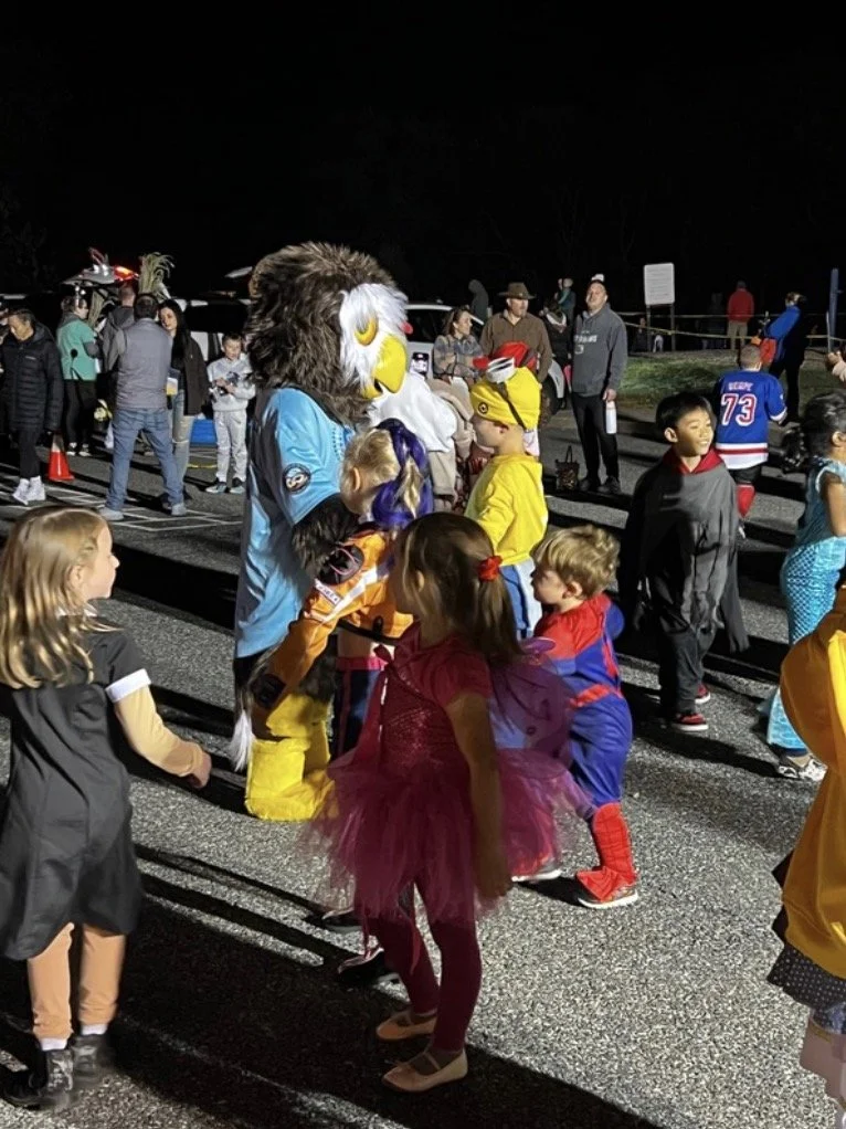 Owlbert surrounded by kids.jpeg