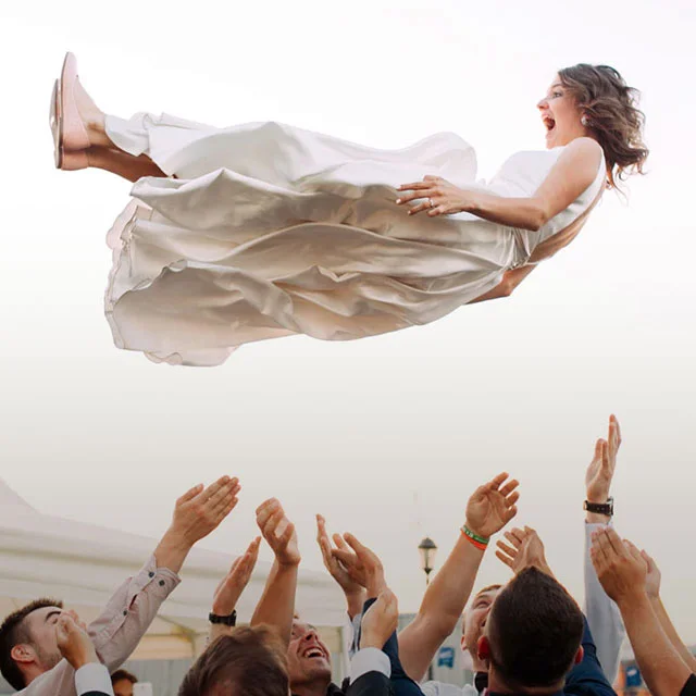 Bride being thrown into air