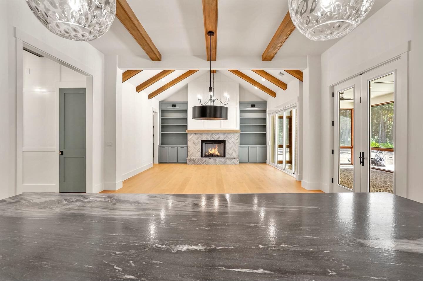 Not a bad view from this kitchen island, eh?

#customhome #customhomebuilder #charlestonsc #chshomes #chsbuilder #newconstruction #kitchenisland #openfloorplan #beamceiling #mtpleasantsc #charlestonhomes