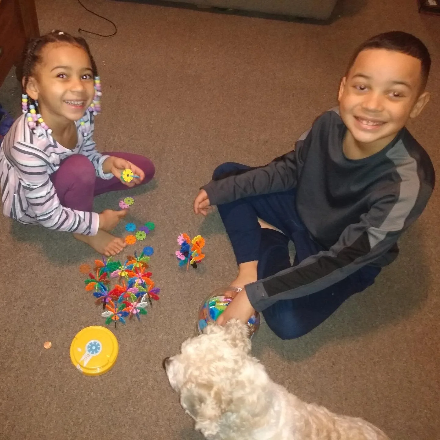 Two of our soccer players enjoying their art kit, sent to them as a part of our winter art class! #soccerforsuccess