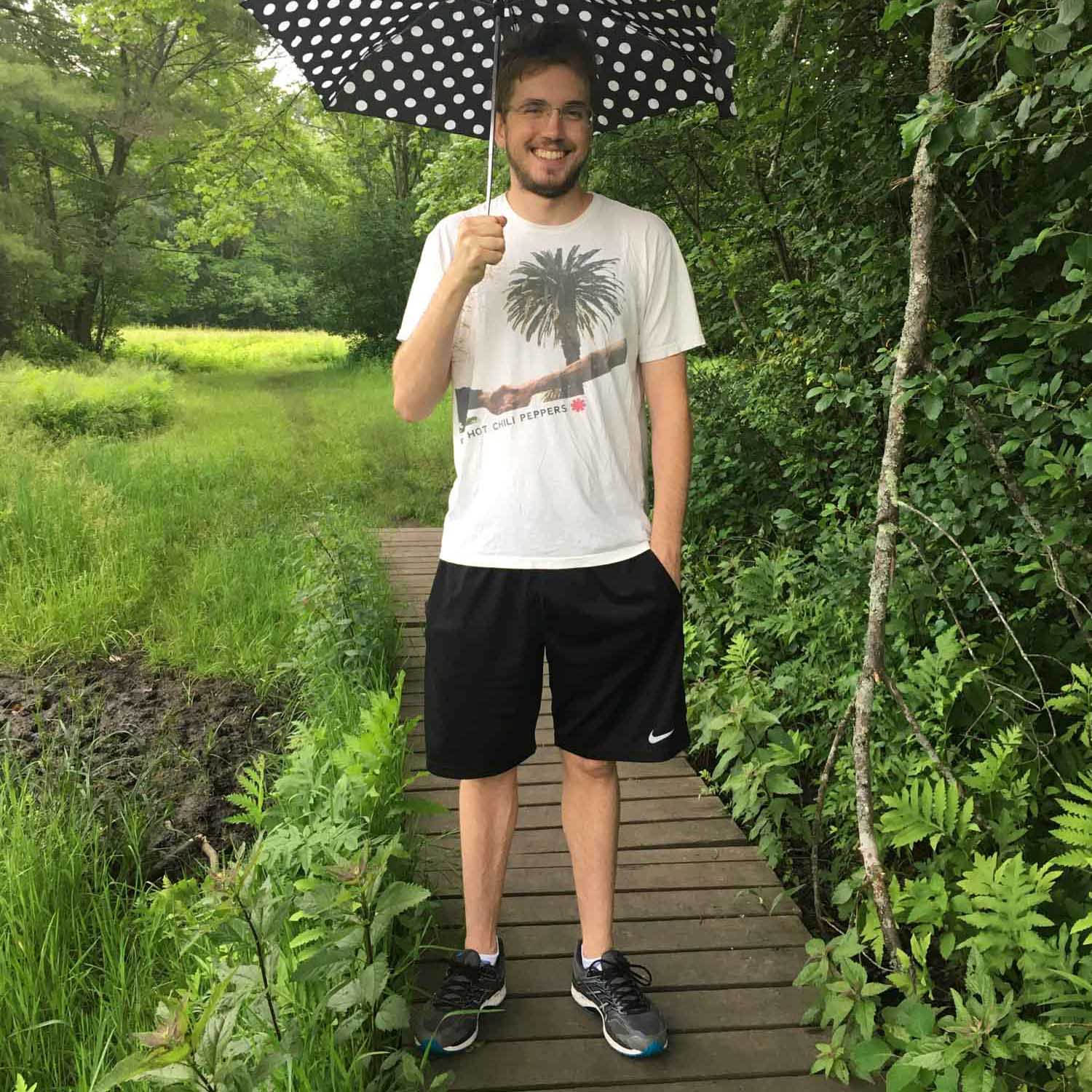 SO student outside smiling with umbrella-c.jpg