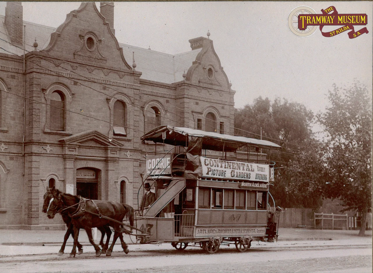A standard Adelaide and Suburban Tramway Company double deck horse tram passing the City Baths (now the site of the ADELAIDE Festival Centre) on King William Road.
