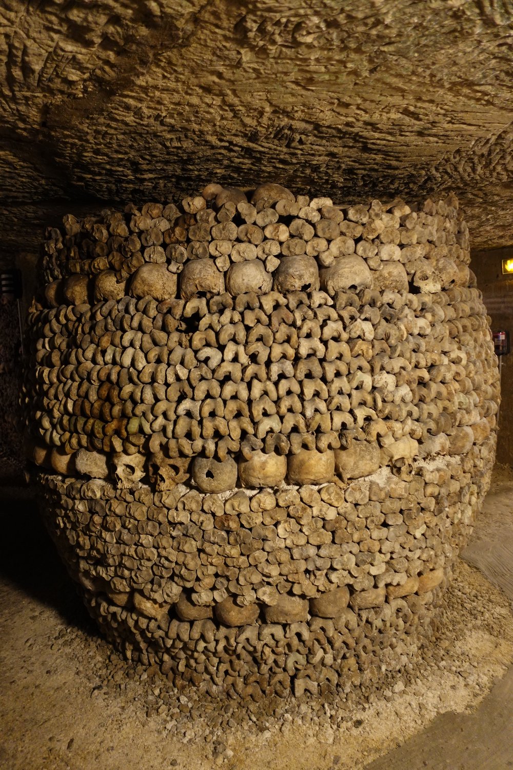 Barrel shaped piles of bones at Catacombs in Paris