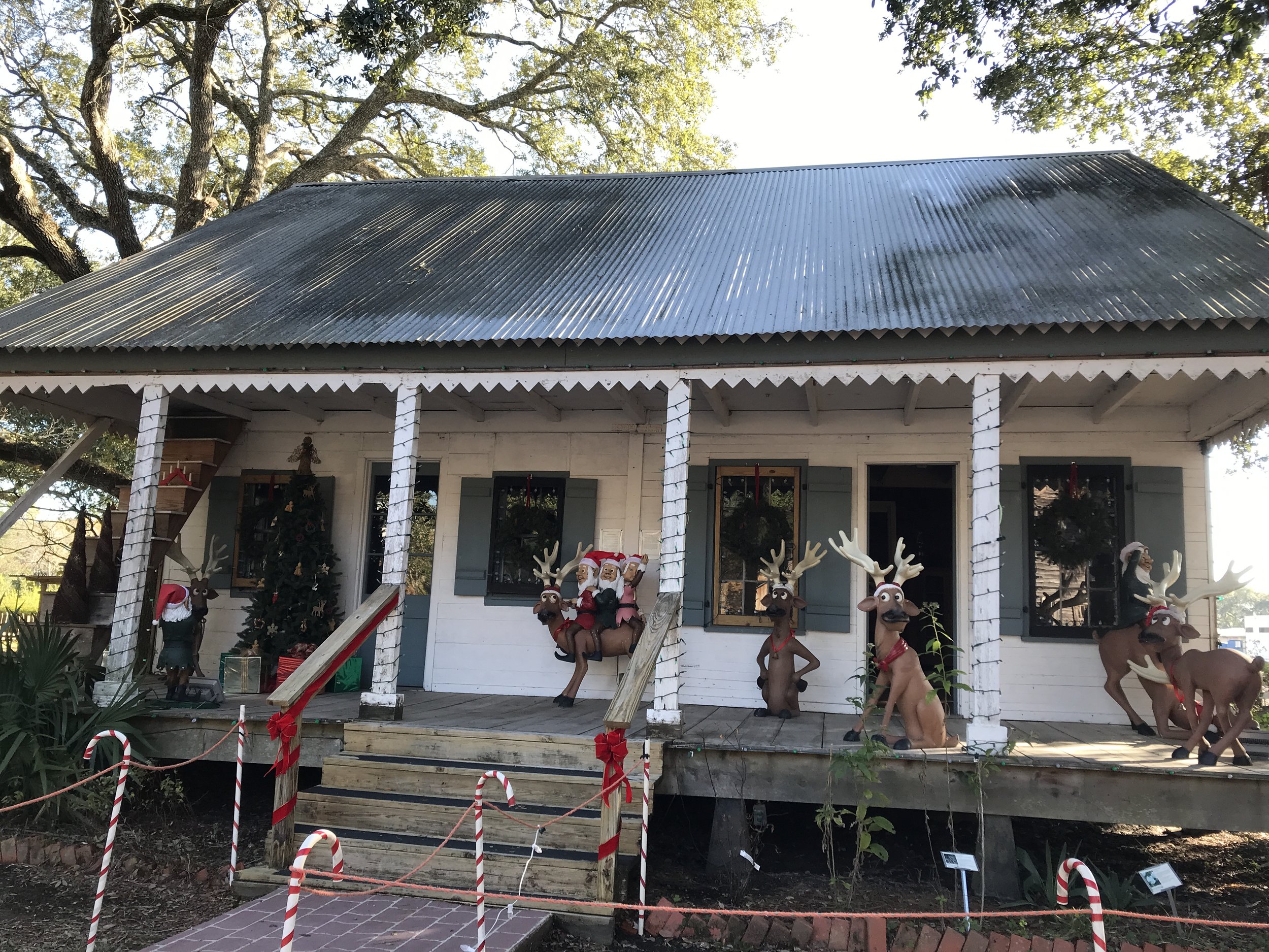 Christmas decorations around a typical Louisiana farmhouse