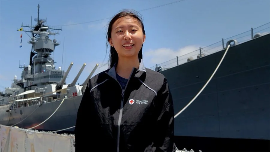 Speaker in front of battleship