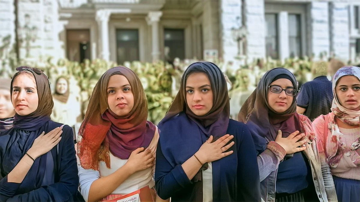 Women in hijab pledge allegiance at state capitol