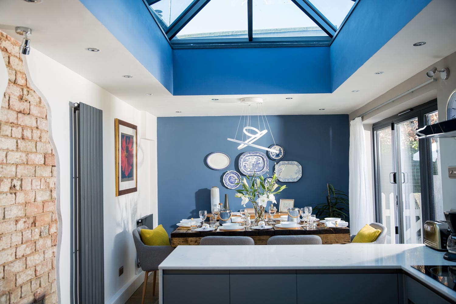 Natural light floods the open plan kitchen diner