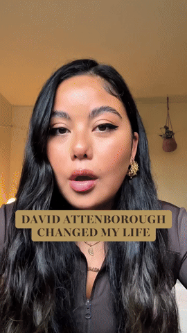 Close-up of a woman with long dark hair, wearing earrings, speaking into the camera, with a caption that reads 'David Attenborough changed my life'.