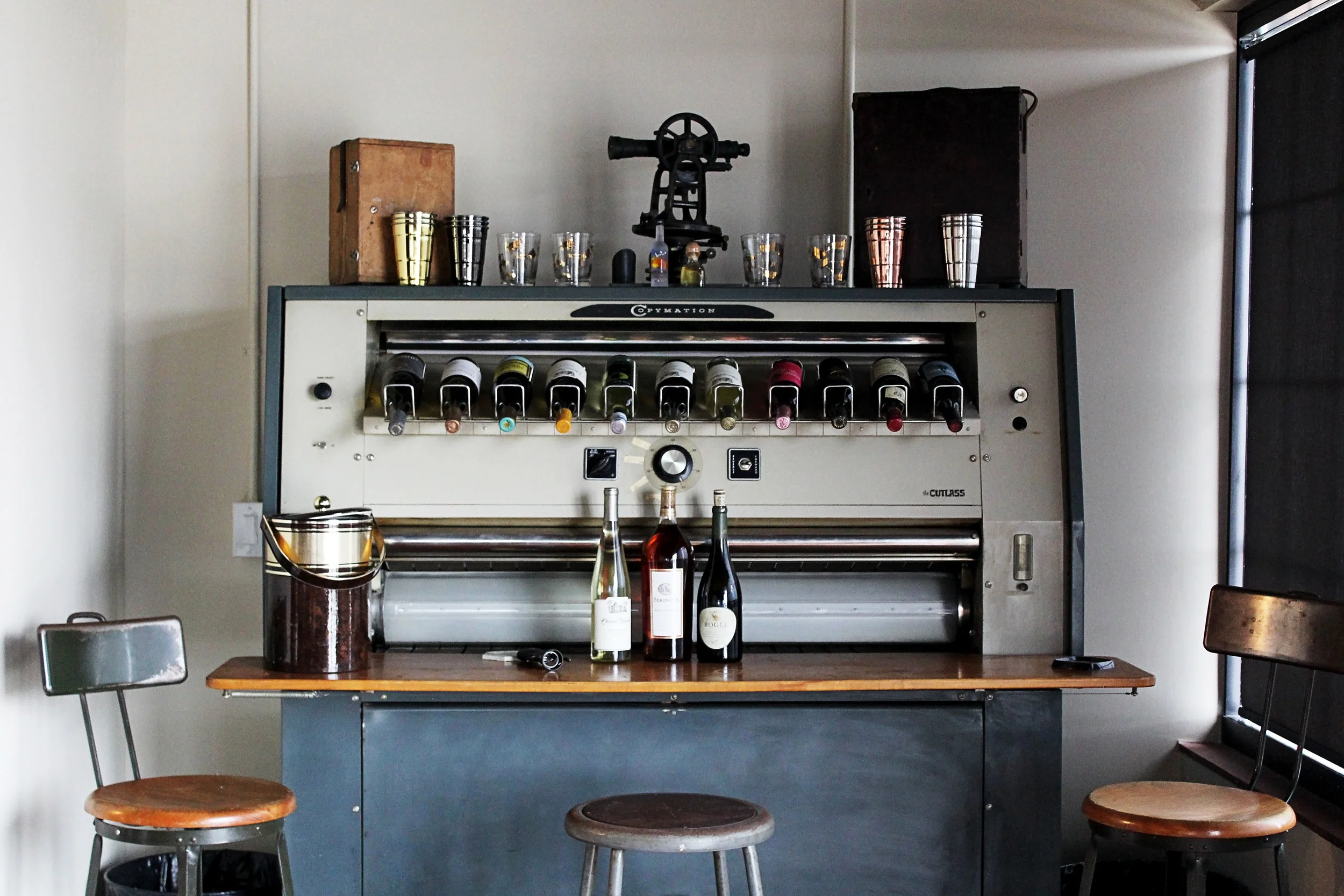 We’ve become enthralled with re-purposing as many of the unique JDQ items as possible!. This is a 1950-1960 era Copymation blueprint machine. Johnson, Depp and Quisenberry provided printing services for large blueprints and engineering drawings. The current owners have converted this lovely item into a ‘plotter-bar’! This transit at the top