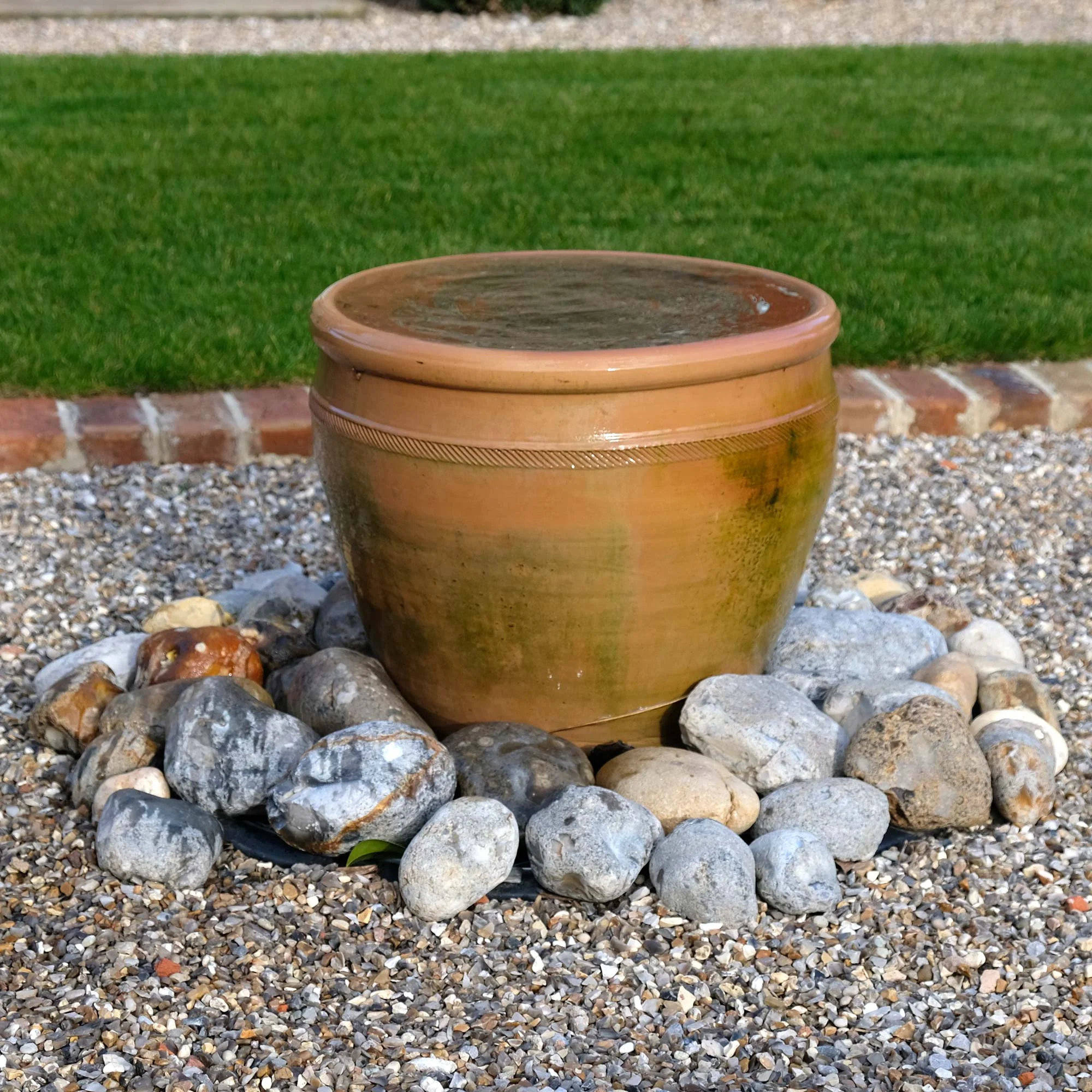 A simple water feature brings the relaxing sound of running water into the garden