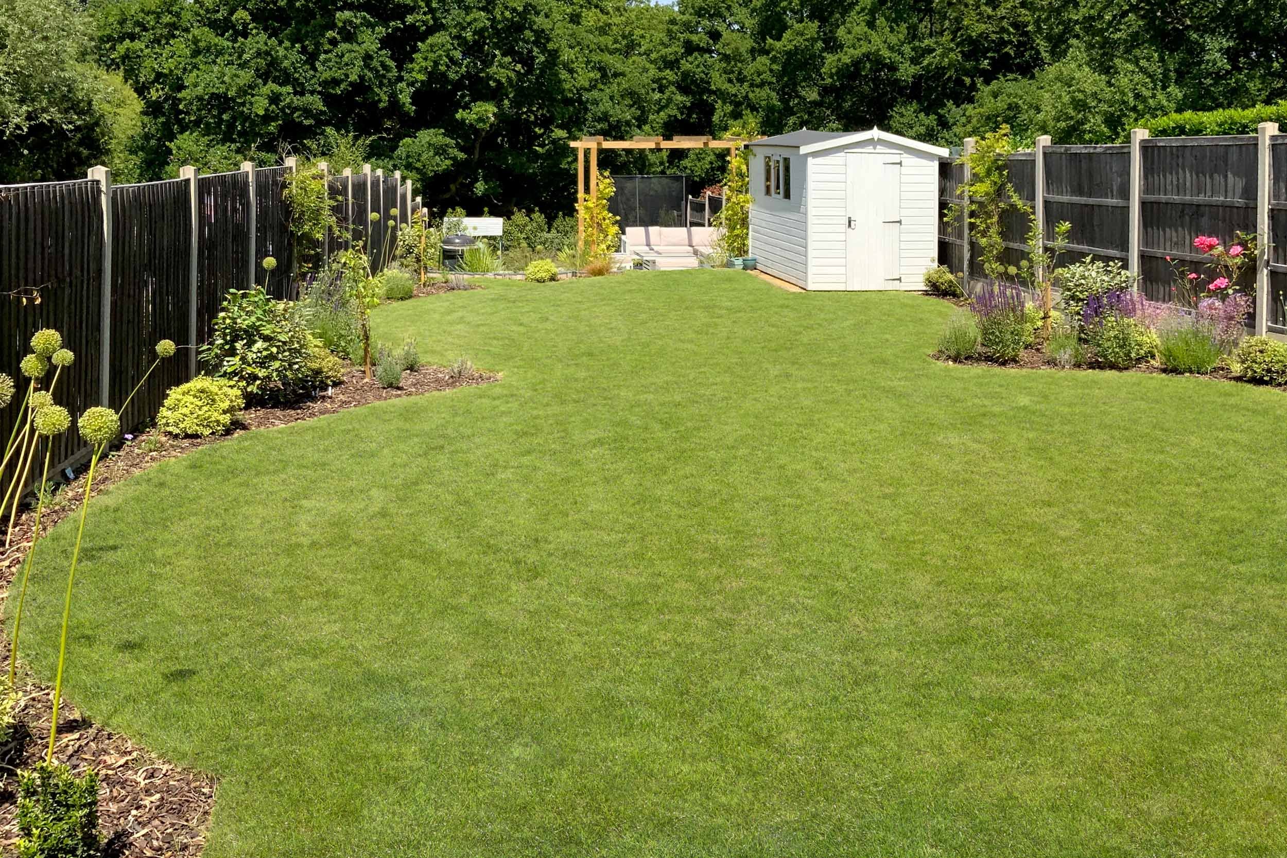 Sloped garden, curved lawn. New build garden landscaping Rowledge, Hampshire near Farnham&nbsp;