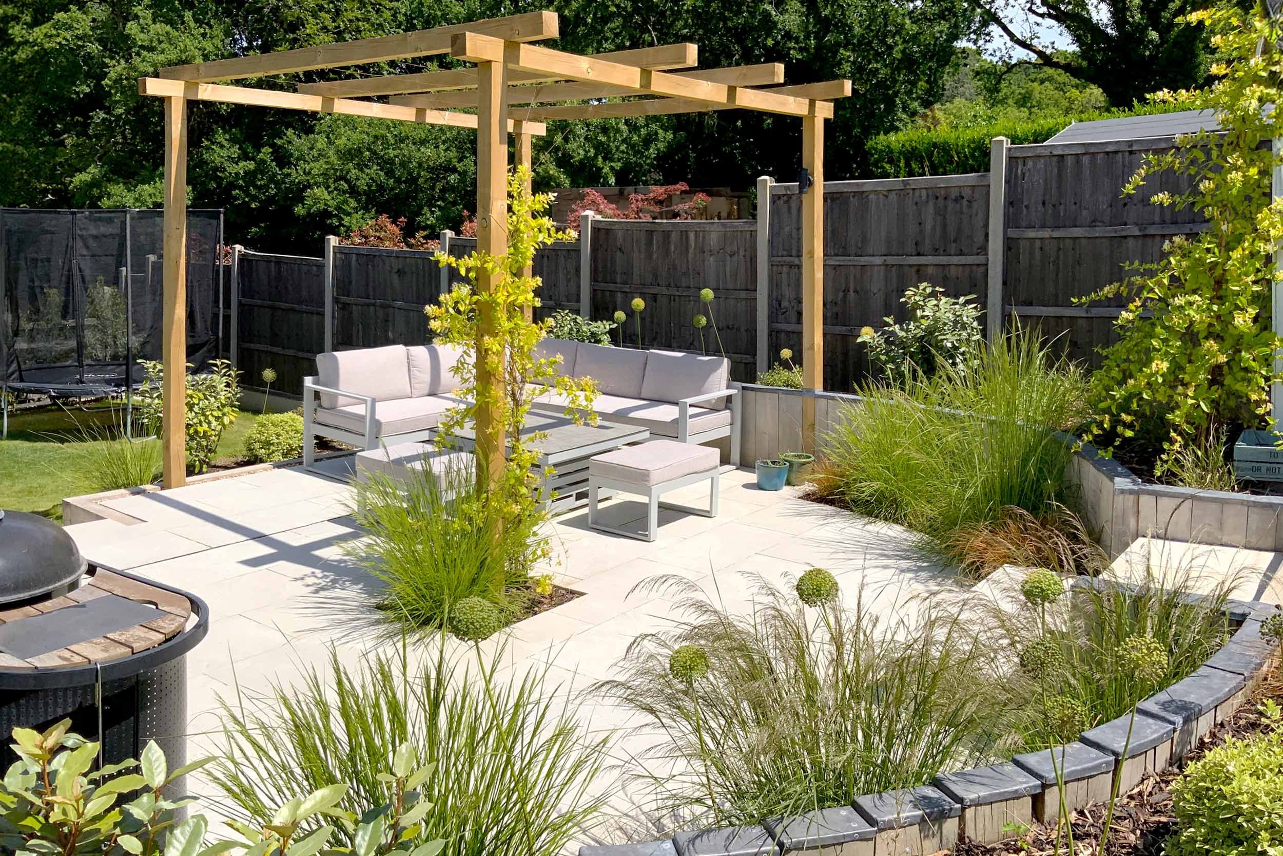 Timber pergola, sleeper walls. Garden design &amp; build near Farnham, Surrey