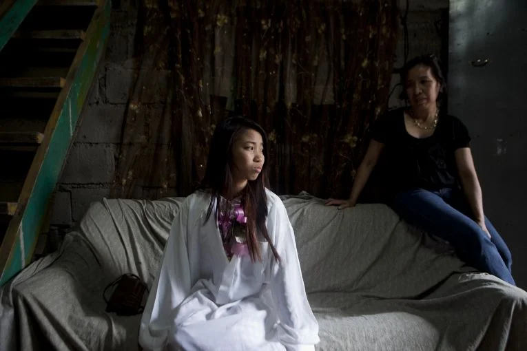 Maribeth Manguerra has been working abroad as a domestic helper for more than a decade. She says she needed to leave to put her kids through school. Image by Geric Cruz.