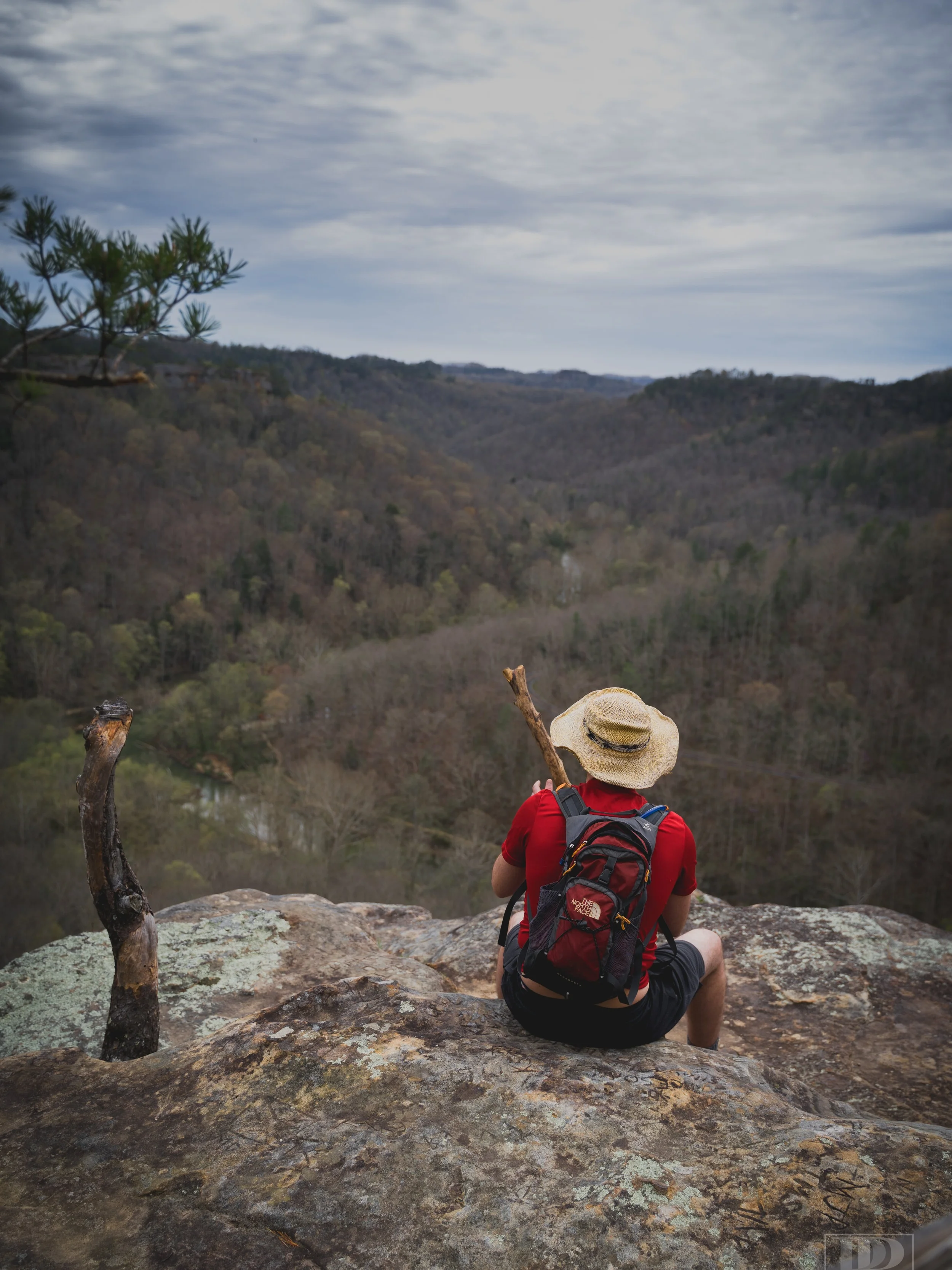 Nobody I know, just some rando that ignored the “YOU’RE GOING TO DIE!” signs posted all over Chimney Rock and hopped over the fence to pop a squat. I appreciate him both risking his life and wearing a nice, contrasty red t-shirt in order for me to get a decent photo.