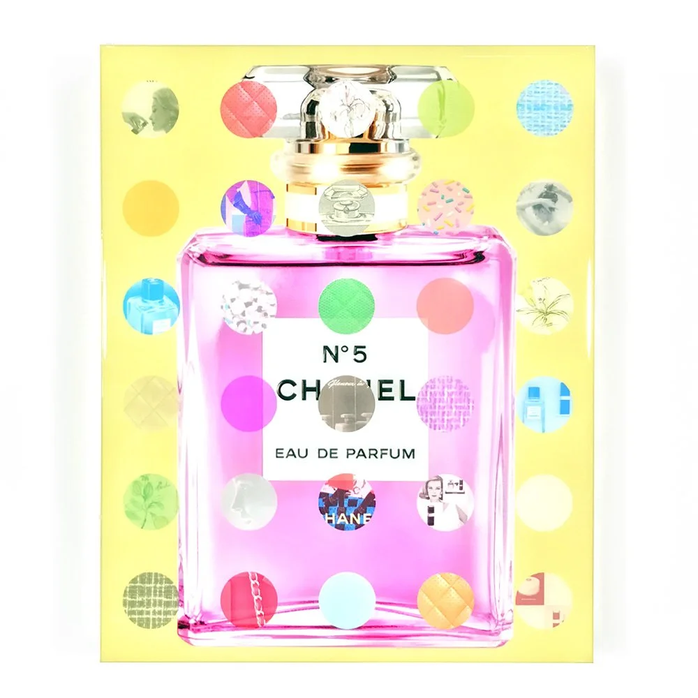 pink bottle of chanel on yellow background