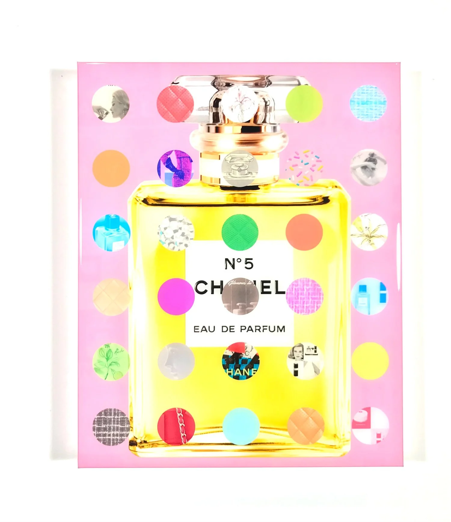 yellow Chanel bottle with pink background