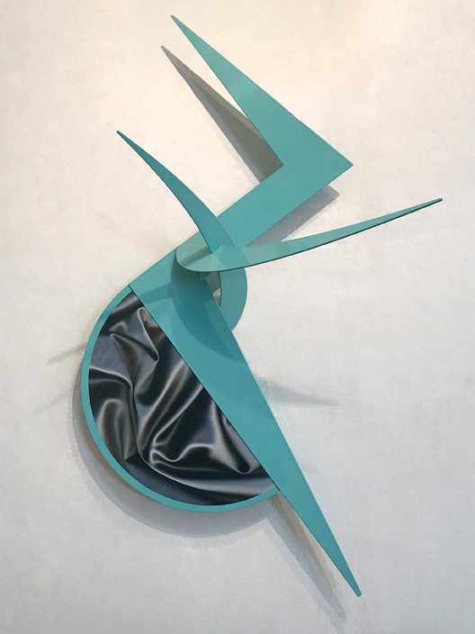 abstract wall sculpture in teal color