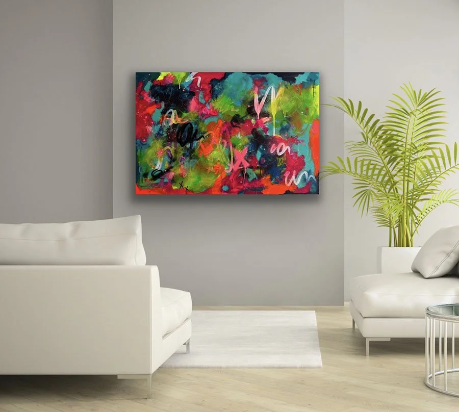Reverie 2 hanging on wall in living space with plant and chair